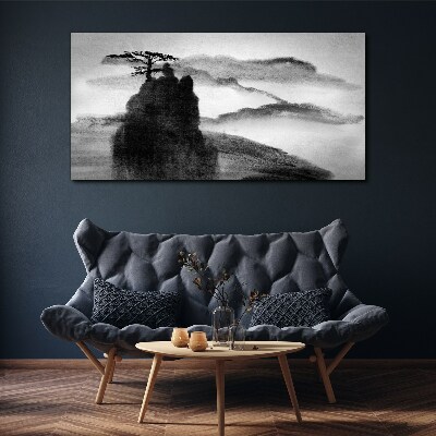 Foto auf leinwand Ein einsamer Baum auf einem felsigen Berg
