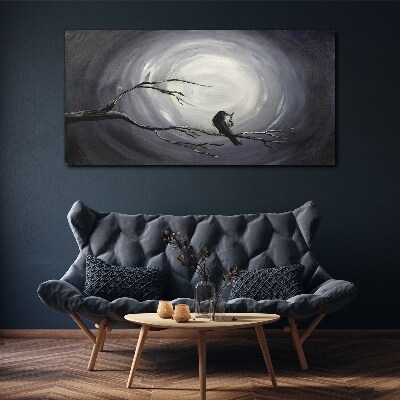 Leinwandbild Ein einsamer Vogel auf einem Ast