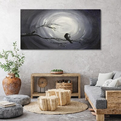 Leinwandbild Ein einsamer Vogel auf einem Ast