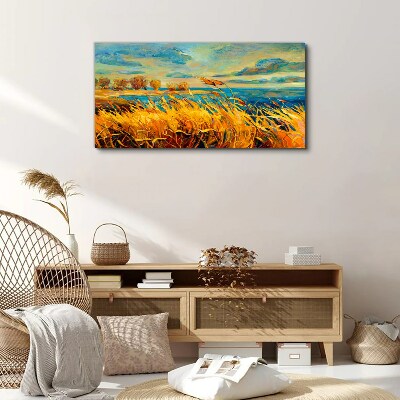 Foto auf leinwand Goldenes Gras über blauem Wasser