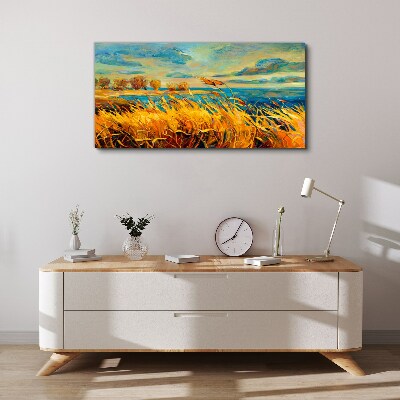 Foto auf leinwand Goldenes Gras über blauem Wasser