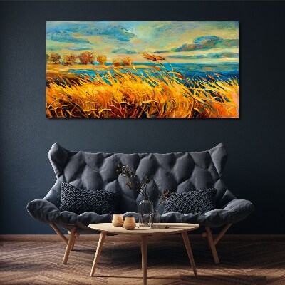Foto auf leinwand Goldenes Gras über blauem Wasser