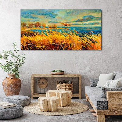 Foto auf leinwand Goldenes Gras über blauem Wasser