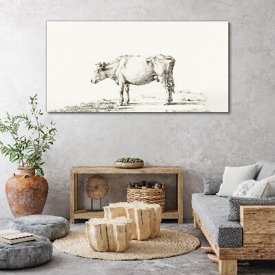 Foto auf leinwand Eine ruhige Kuh vor der Kulisse der Natur