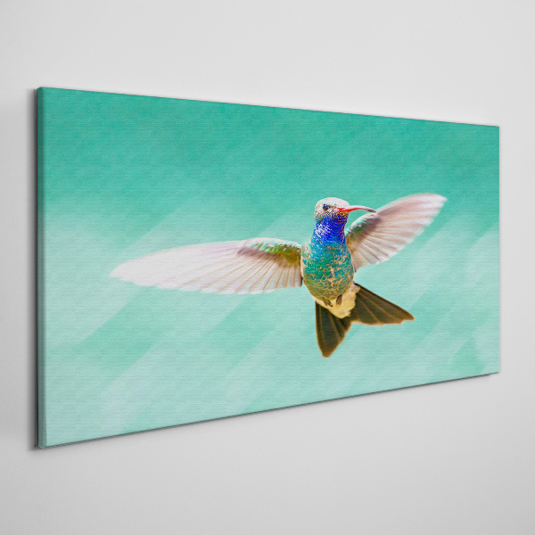 Leinwandbild Kolibri auf blauem Hintergrund