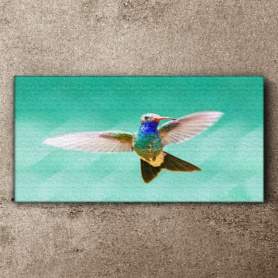 Leinwandbild Kolibri auf blauem Hintergrund