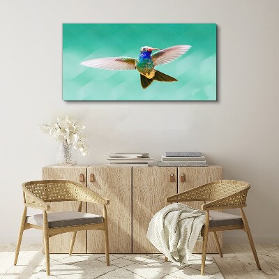 Leinwandbild Kolibri auf blauem Hintergrund
