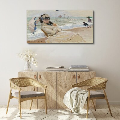 Foto auf leinwand Frau am Strand mit einem Sonnenschirm