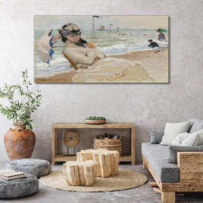 Foto auf leinwand Frau am Strand mit einem Sonnenschirm