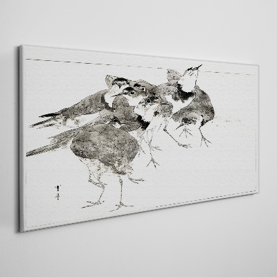 Foto auf leinwand Ein Vogelschwarm vor weißem Hintergrund