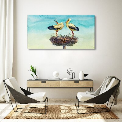 Foto auf leinwand Störche auf einem Nest im Blau