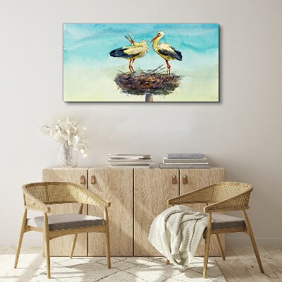 Foto auf leinwand Störche auf einem Nest im Blau
