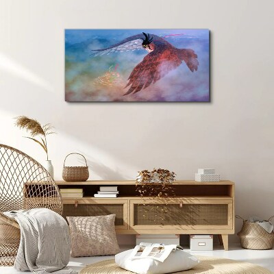 Foto auf leinwand Flug eines Raubvogels in den Wolken