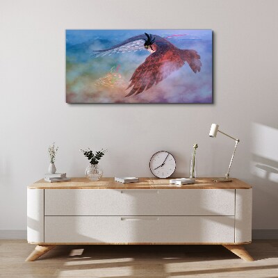 Foto auf leinwand Flug eines Raubvogels in den Wolken