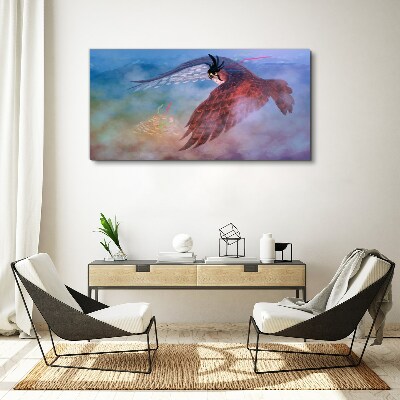 Foto auf leinwand Flug eines Raubvogels in den Wolken