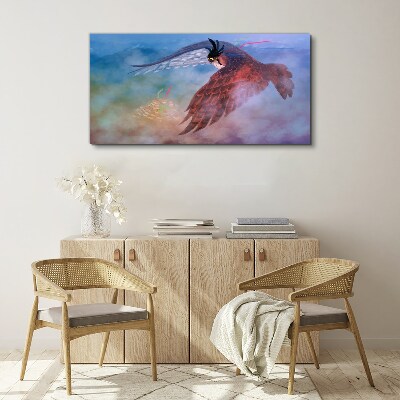 Foto auf leinwand Flug eines Raubvogels in den Wolken