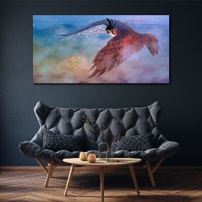 Foto auf leinwand Flug eines Raubvogels in den Wolken