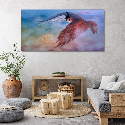 Foto auf leinwand Flug eines Raubvogels in den Wolken