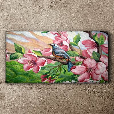 Foto auf leinwand Ein Vogel vor einem Hintergrund aus Frühlingsblumen