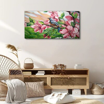 Foto auf leinwand Ein Vogel vor einem Hintergrund aus Frühlingsblumen
