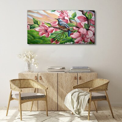Foto auf leinwand Ein Vogel vor einem Hintergrund aus Frühlingsblumen