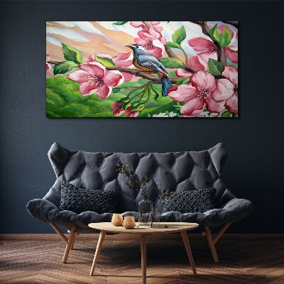 Foto auf leinwand Ein Vogel vor einem Hintergrund aus Frühlingsblumen