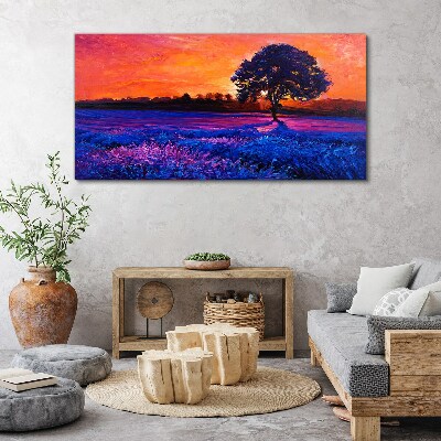Foto auf leinwand Sonnenuntergang über einem lila Feld