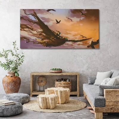 Foto auf leinwand Vogelflug in der untergehenden Sonne