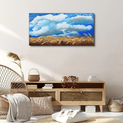 Foto auf leinwand Sommerhimmel über einem goldenen Feld
