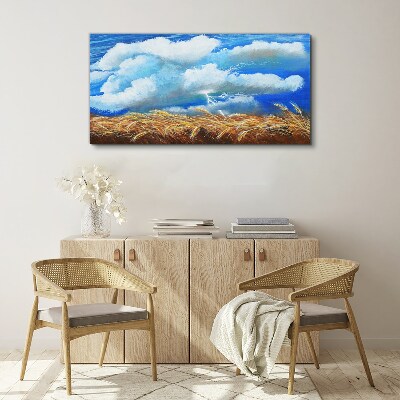 Foto auf leinwand Sommerhimmel über einem goldenen Feld