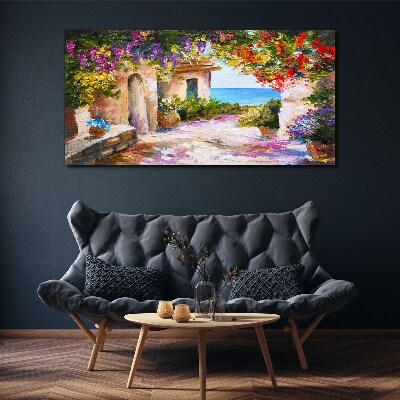 Foto auf leinwand Die Blumenallee eines Küstendorfes