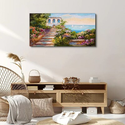 Foto auf leinwand Ein Spaziergang zwischen Blumen am Meer