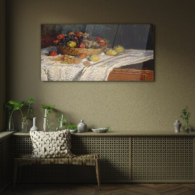 Glasbild Obstkorb auf einer weißen Tischdecke