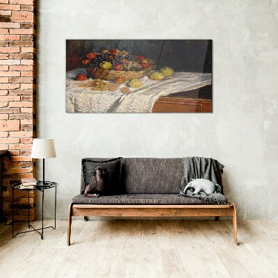 Glasbild Obstkorb auf einer weißen Tischdecke