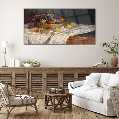 Glasbild Obstkorb auf einer weißen Tischdecke