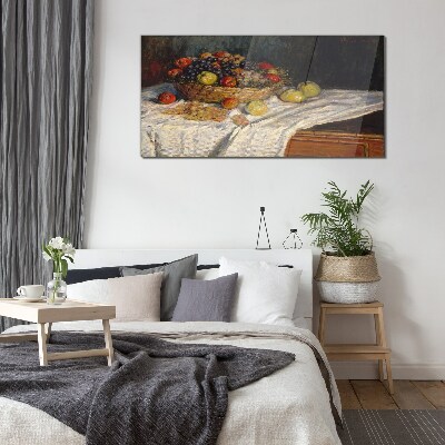 Glasbild Obstkorb auf einer weißen Tischdecke