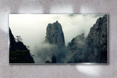 Glasbild Neblige Berglandschaft