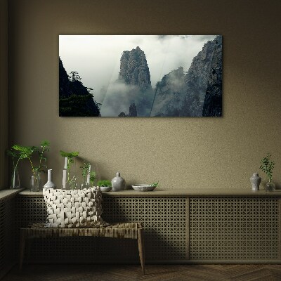 Glasbild Neblige Berglandschaft