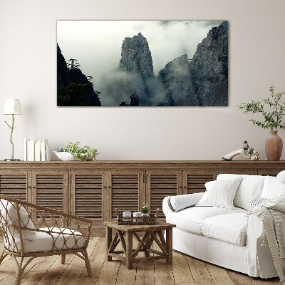 Glasbild Neblige Berglandschaft