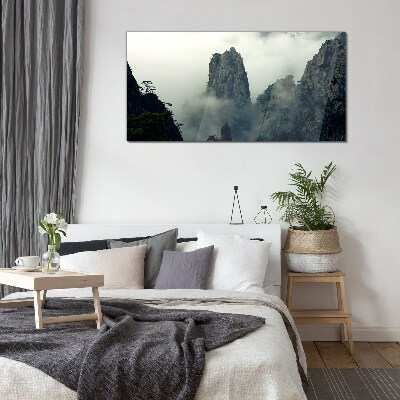 Glasbild Neblige Berglandschaft