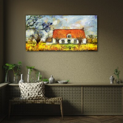 Glasbild Ein farbenfrohes Landhaus in der Landschaft