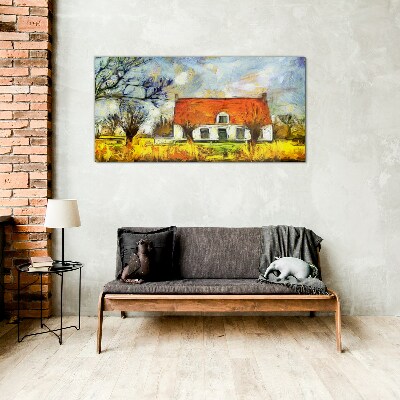 Glasbild Ein farbenfrohes Landhaus in der Landschaft
