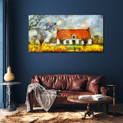 Glasbild Ein farbenfrohes Landhaus in der Landschaft