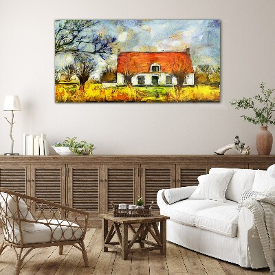Glasbild Ein farbenfrohes Landhaus in der Landschaft