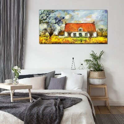 Glasbild Ein farbenfrohes Landhaus in der Landschaft