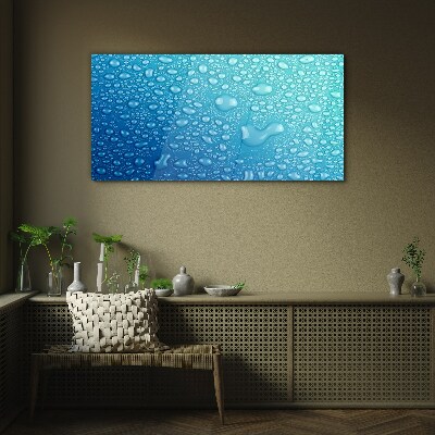 Glasbild Wassertropfen auf blauem Hintergrund
