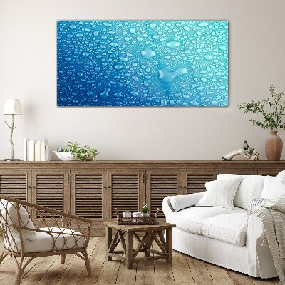 Glasbild Wassertropfen auf blauem Hintergrund