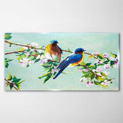Glasbild Vögel auf einem blühenden Zweig