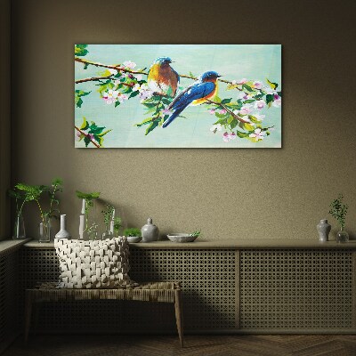 Glasbild Vögel auf einem blühenden Zweig