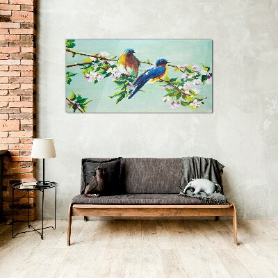 Glasbild Vögel auf einem blühenden Zweig